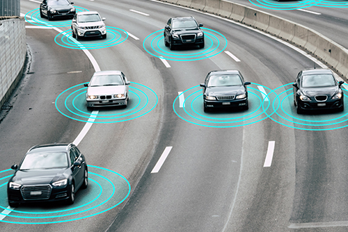 Illustration and photo of a autonomous self-driving cars driving on a highway. The cars are connected through wireless technology and artificial intelligence which enables them to drive on the road safely.