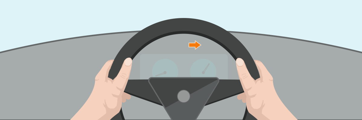 Hands on steering wheel with an indicator light on the dash 