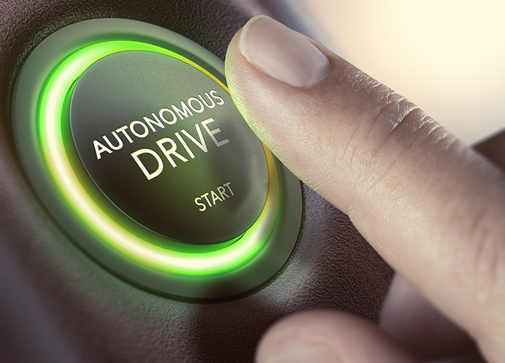 Finger pressing a push button to start a self-driving car. Composite image between a hand photography and a 3D background.