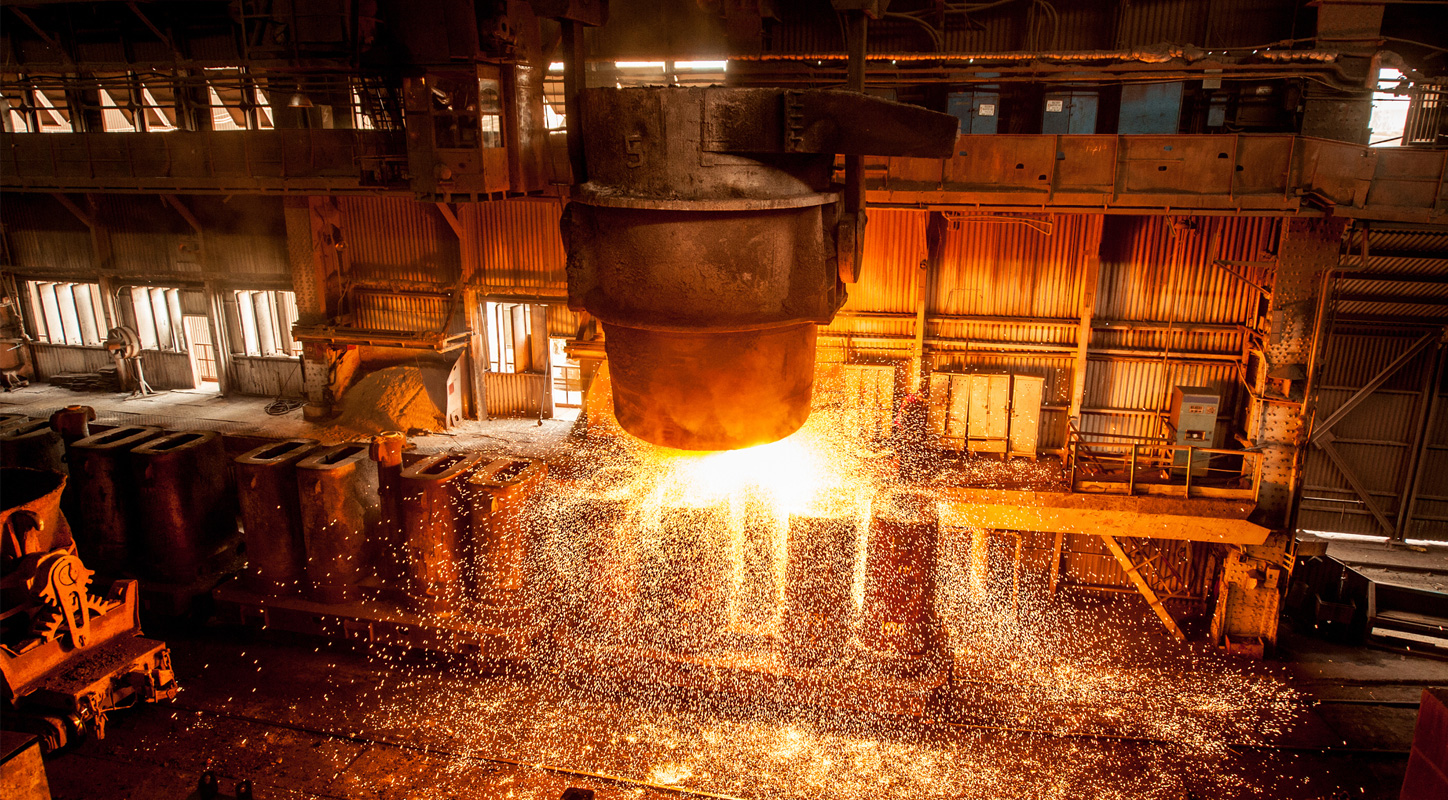 Photograph of smouldering metal being melted for reuse