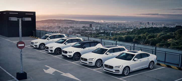 Volvo hybrid cars parked on a rooftop car park